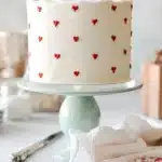 Delicious Valentine's Cake decorated with heart shapes and roses.