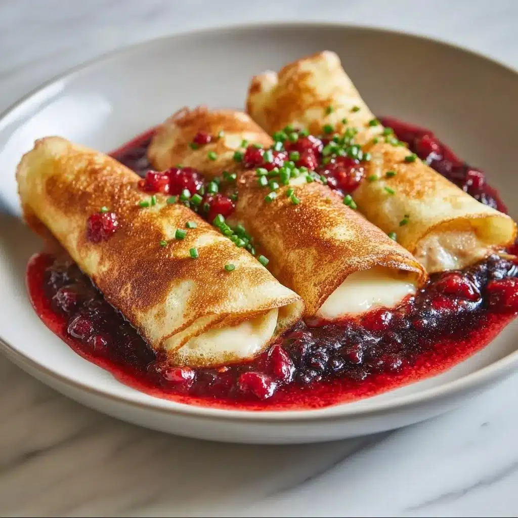 Homemade blintzes filled with creamy cheese and topped with berries