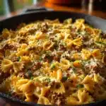Cajun Cream Cheese Alfredo Bowties topped with spiced ground beef.