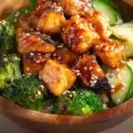 Crispy Bang Bang Salmon Bites served in a vibrant bowl with fresh ingredients.