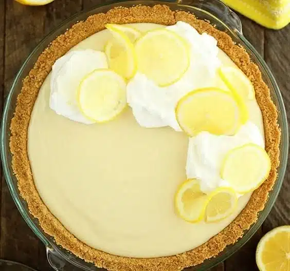 Easy lemon cream pie with whipped cream topping and lemon zest garnish.