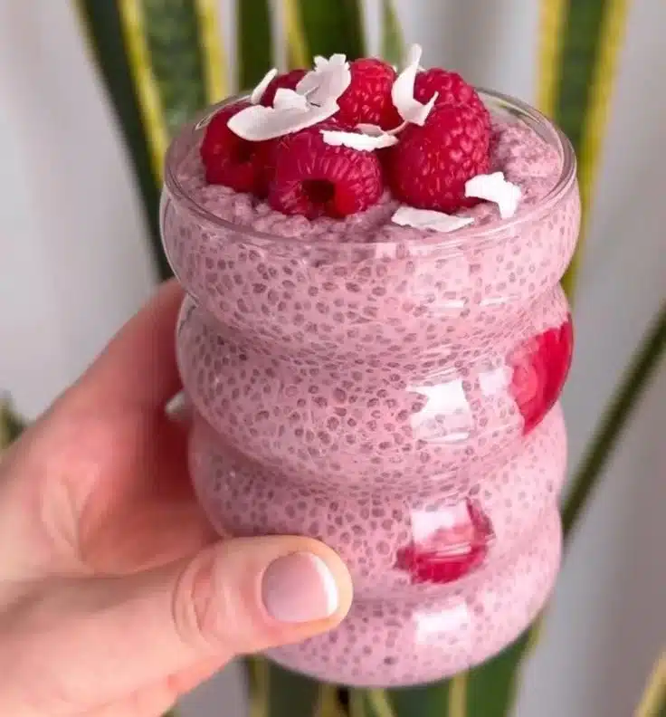 Healthy Raspberry Chia Pudding served in a bowl with fresh raspberries on top