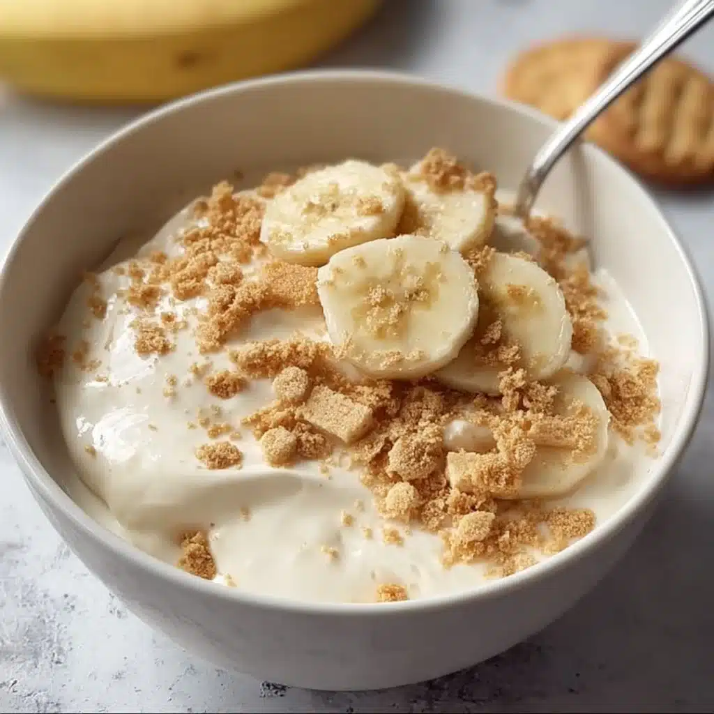 Healthy high protein banana pudding bowl topped with fresh bananas and nuts