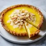 Lemon Mascarpone Tart with a flaky crust and fresh lemon slices