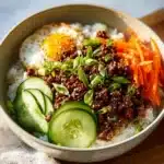 Delicious Korean Ground Beef bowl topped with vegetables and rice