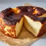 Delicious Basque Burnt Cheesecake with a caramelized top on a white plate