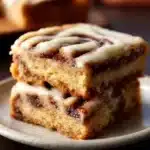 Irresistible cinnamon roll bliss bars topped with icing