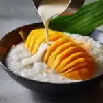 Delicious Mango Sticky Rice with fresh mango slices and coconut sauce