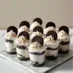 Mini Oreo Dessert Cups with whipped cream cheese filling served in clear cups