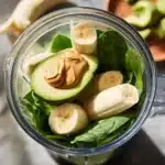 Spinach avocado smoothie filled with vitamins and healthy fats.